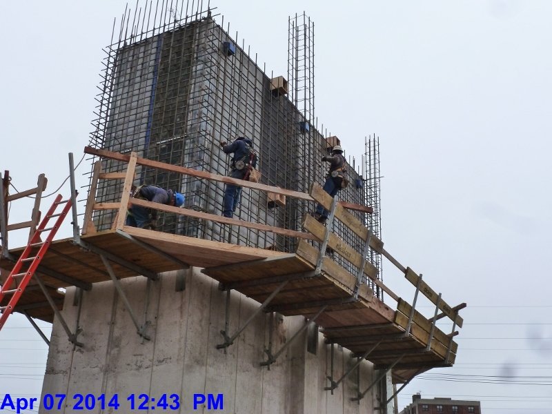 Tying up the rebar mats at Elev. 1,2,3 2nd Floor Facing South-East (800x600)